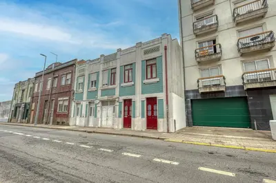 a row of buildings on the side of a street at OPORTO GUEST Downtown Escape in Porto