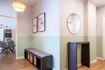 a living room with a fireplace and a mirror at Santa Catarina Haven by LovelyStay in Porto