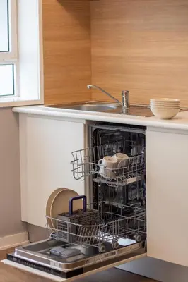 a dishwasher in a kitchen with dishes in it at Santa Catarina Haven by LovelyStay in Porto