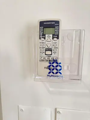 a remote control in a plastic box on a wall at Lili's Garden Priv Terrace TWO flats Laundry by MyMoradia in Porto