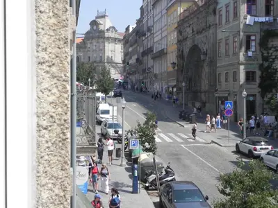 a view of a city street with people walking and cars at Porto Breeze in Porto