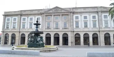 a large building with a fountain in front of a building at Open-Air Terrace Studio in Historic Heart of Porto in Porto