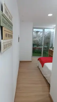 a room with a bed and signs on the wall at Open-Air Terrace Studio in Historic Heart of Porto in Porto
