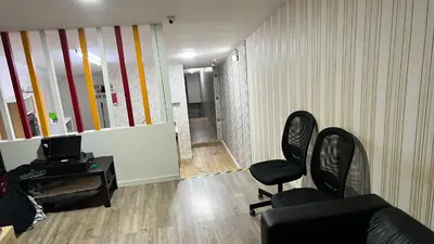 an office with two chairs and a television in a room at Majestic Hostel Porto in Porto