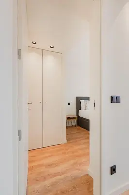 a room with white walls and a bedroom with a bed at Balcony Garden Views at Terracotta Collection in Porto