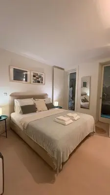 a bedroom with a large bed with two towels on it at Guindais River View I in Porto