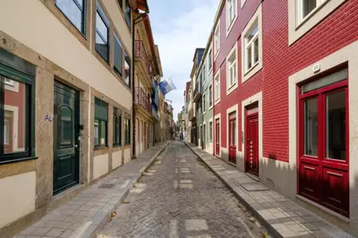 an empty street in an old city with buildings at Magnolia 5 Luxury with AC Metro Downtown Porto in Porto