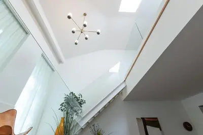 a room with a skylight and a ceiling at Breathtaking Loft in Award-Winning Building in Porto