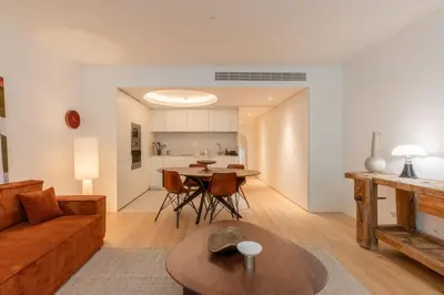 a living room with a couch and a table at Breathtaking Loft in Award-Winning Building in Porto