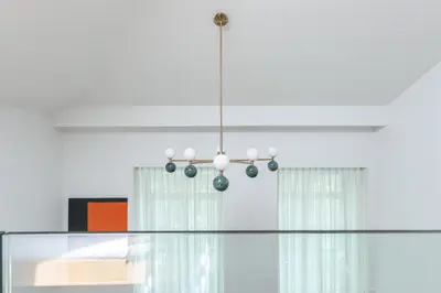 a chandelier hanging from a ceiling in a room at Breathtaking Loft in Award-Winning Building in Porto