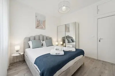 a bedroom with a large bed with towels on it at GuestReady - An elegant stay in the city centre in Porto