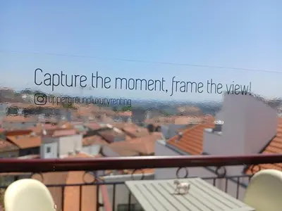 a picture of a view of a city with the words capture the moment frame at Top of the World by Upperground in Porto