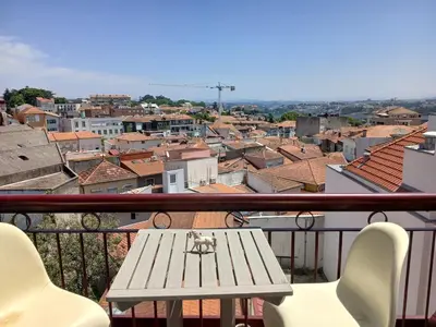 a table on a balcony with a view of a city at Top of the World by Upperground in Porto