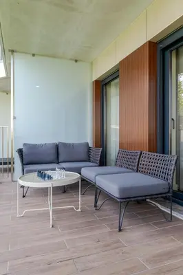 a living room with a couch and a table at Studio w/ Balcony, Pool & Gym in Antas by HostWise in Porto