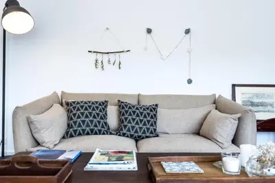 a living room with a couch and a coffee table at KOPKE 113, local & spacious 2Bed in Porto