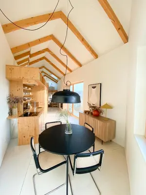a dining room with a black table and chairs at Plunge Pool River Views Apt A Adults Only in Porto