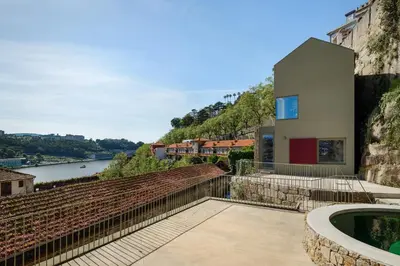 a house on a hill with a view of a river at Plunge Pool River Views Apt A Adults Only in Porto