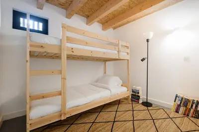 a bedroom with two bunk beds in a room at Cool Alegria Loft Mezzanine Retreat in Porto