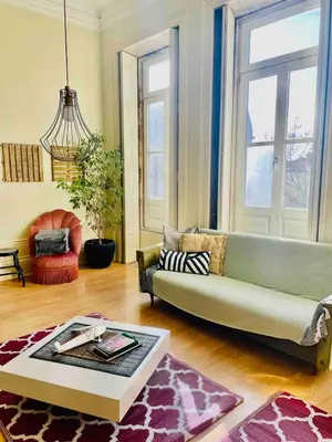 a living room with a couch and a table at Ai Porto! Gold&Soul in Porto
