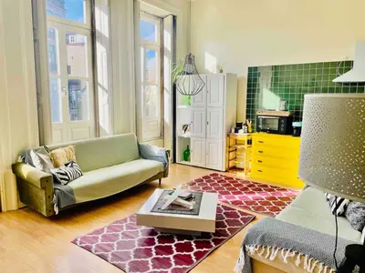 a living room with a couch and a rug at Ai Porto! Gold&Soul in Porto