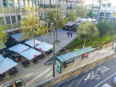 an overhead view of a bus stop with blue roofs at Ai Porto! Gold&Soul in Porto