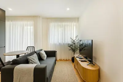 a living room with a couch and a table at GuestReady - Gracious City Escape in Porto in Porto