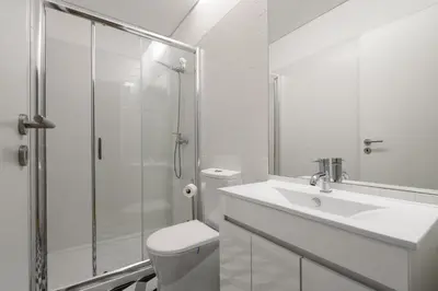 a bathroom with a toilet and a sink and a shower at Cool Alegria 1 Bed Studio Retreat in Bicas