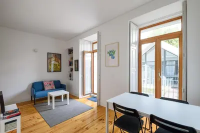 a living room with a table and chairs at Cool Alegria 1 Bed Studio Retreat in Bicas