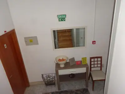 a room with a table and a chair and a window at Portuense Alojamento Local in Porto