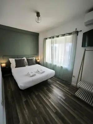 a bedroom with a large white bed and a window at Best Deal Porto Apartment - Porto Velho Apt in Porto
