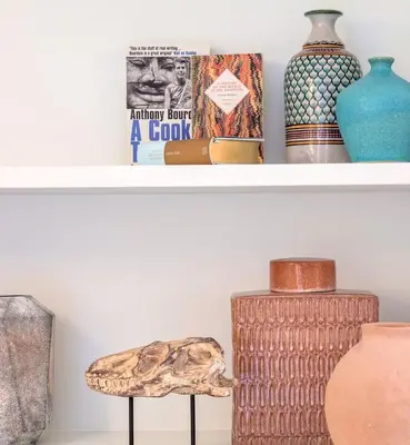 a shelf with vases and other items on it at Quinta de Sá in Vila Nova de Gaia
