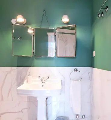 a bathroom with a sink and two mirrors at Quinta de Sá in Vila Nova de Gaia