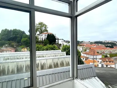 a view of a city from a window at Your house in Porto in Vila Nova de Gaia