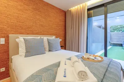a bedroom with a bed with a view of a pool at Lovely & Centre Flat with Terrace by HostWise in Porto