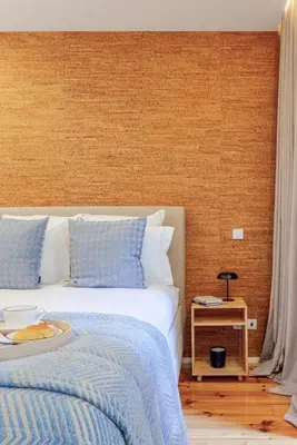 a hotel room with a bed and a table at Lovely & Centre Flat with Terrace by HostWise in Porto
