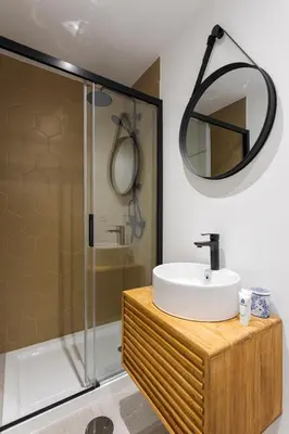 a bathroom with a sink and a shower at Bright Flat | Romantic Escape by HostWise in Porto