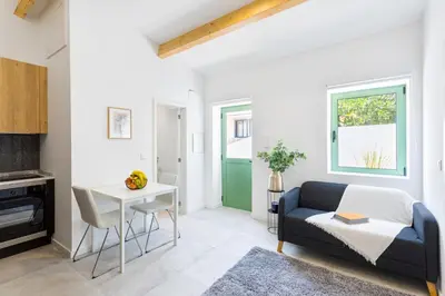 a living room with a couch and a table at Bright Flat | Romantic Escape by HostWise in Porto