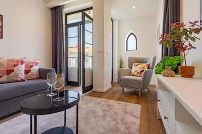 a living room with a couch and a table at NorteSoul OldTown - 2 Bedroom 2 Bathroom Apartment! in Porto