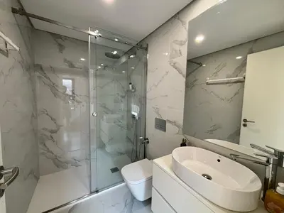 a bathroom with a shower and a sink and a toilet at AC, 2Bedrooms APT, City Center 900m to Metro in Porto