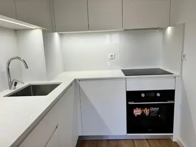 a white kitchen with a sink and a dishwasher at AC, 2Bedrooms APT, City Center 900m to Metro in Porto