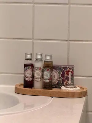 a wooden tray with three jars of honey and a box at Alegria Vintage Apartments - Porto in Porto
