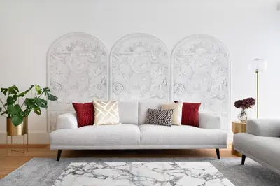 a living room with a white couch with red pillows at Sa Bandeira Signature Apartment in Porto