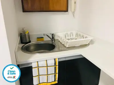 a kitchen counter with a sink and a sink at In Love Bolhão in Porto
