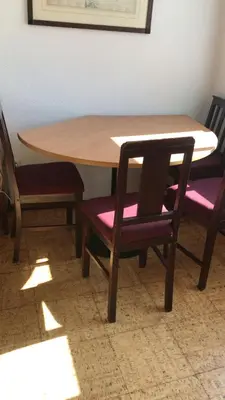 a wooden table with two chairs and a table with a table and a table at Quiet Studio City Center in Porto