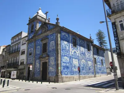 an old building with blue tiles on it on a street at Quiet Studio City Center in Porto