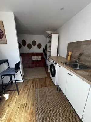a kitchen with a sink and a washing machine at Simple House in the Heart of the Historic Center in Porto