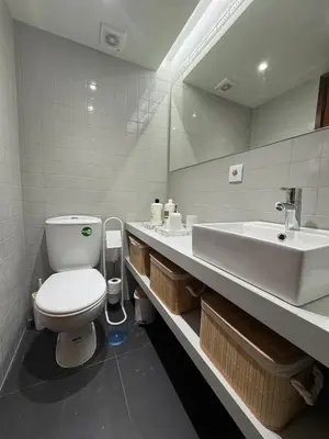 a bathroom with a toilet and a sink at Casa da Música Apartment in Porto