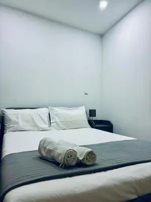 a white bed with a towel on top of it at Porto Old Town Escape in Porto