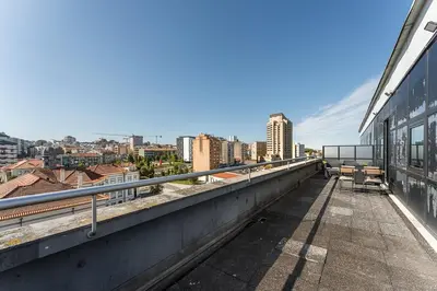 a balcony with a view of a city at GuestReady – Urban comfort in Vila Nova de Gaia in Vila Nova de Gaia