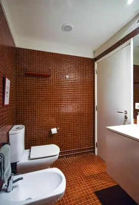 a bathroom with a toilet and a sink at Porto Pátio by MP in Porto